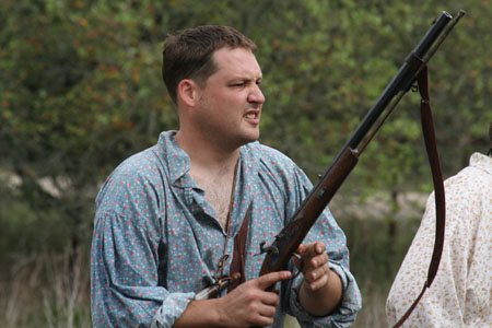 Michael gets ready to fire with a percussion ignition rifle